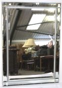 A contemporary bevelled edge wall mirror.