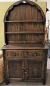 A contemporary carved wooden kitchen dresser.