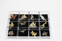 A group of twelve modern enamel and gilt metal animal brooches.