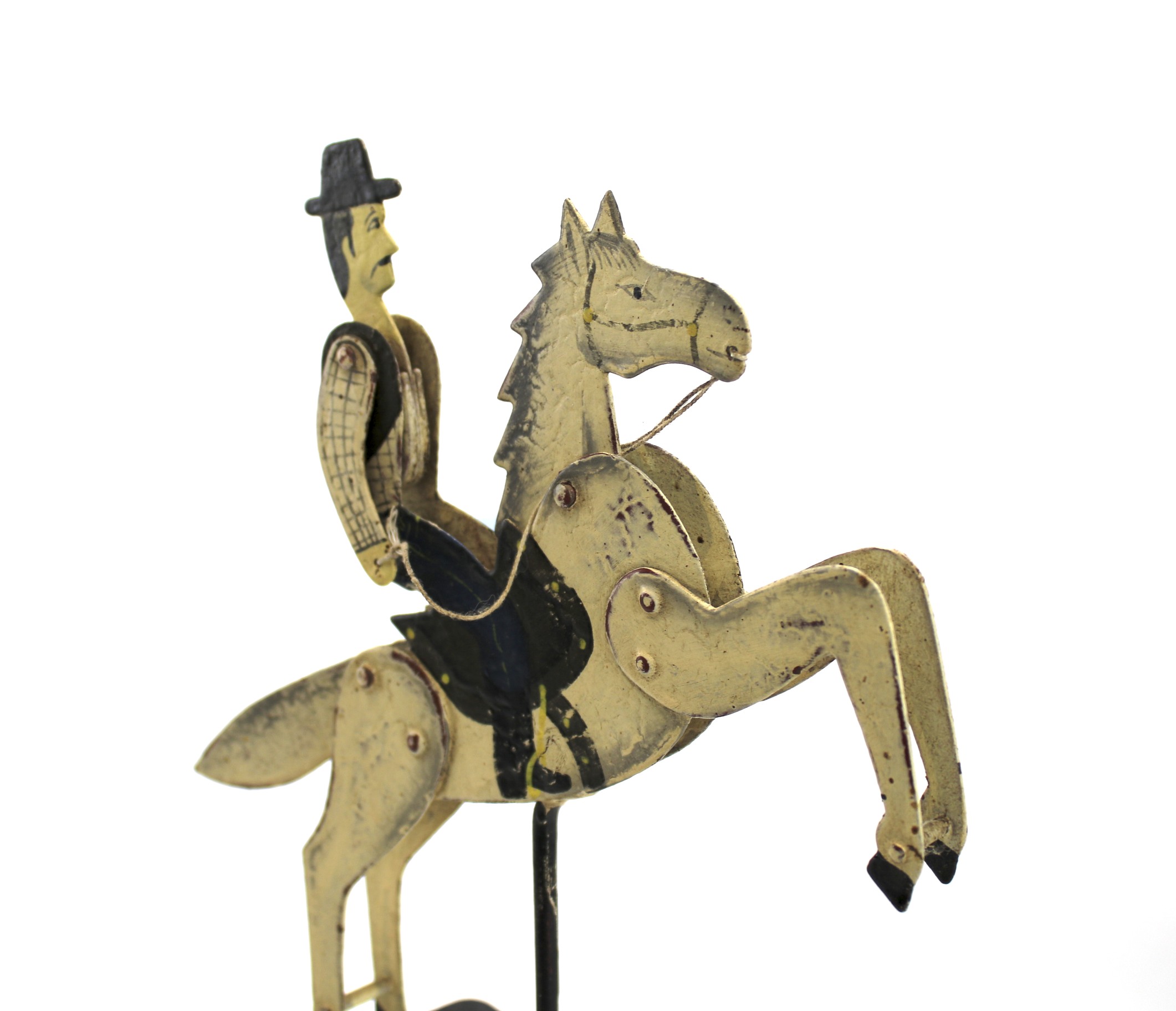 A novelty tinplate toy featuring a cowboy on horseback. - Image 2 of 2