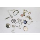 A collection of silver and white metal jewellery. Including medals, pendants brooches, bracelets.