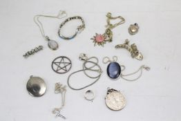 A collection of silver and white metal jewellery. Including medals, pendants brooches, bracelets.