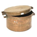 A large copper lidded pot.