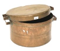 A large copper lidded pot.