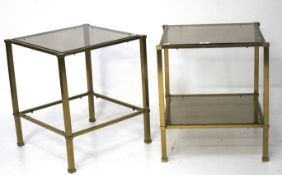 A pair of contemporary glass tables.