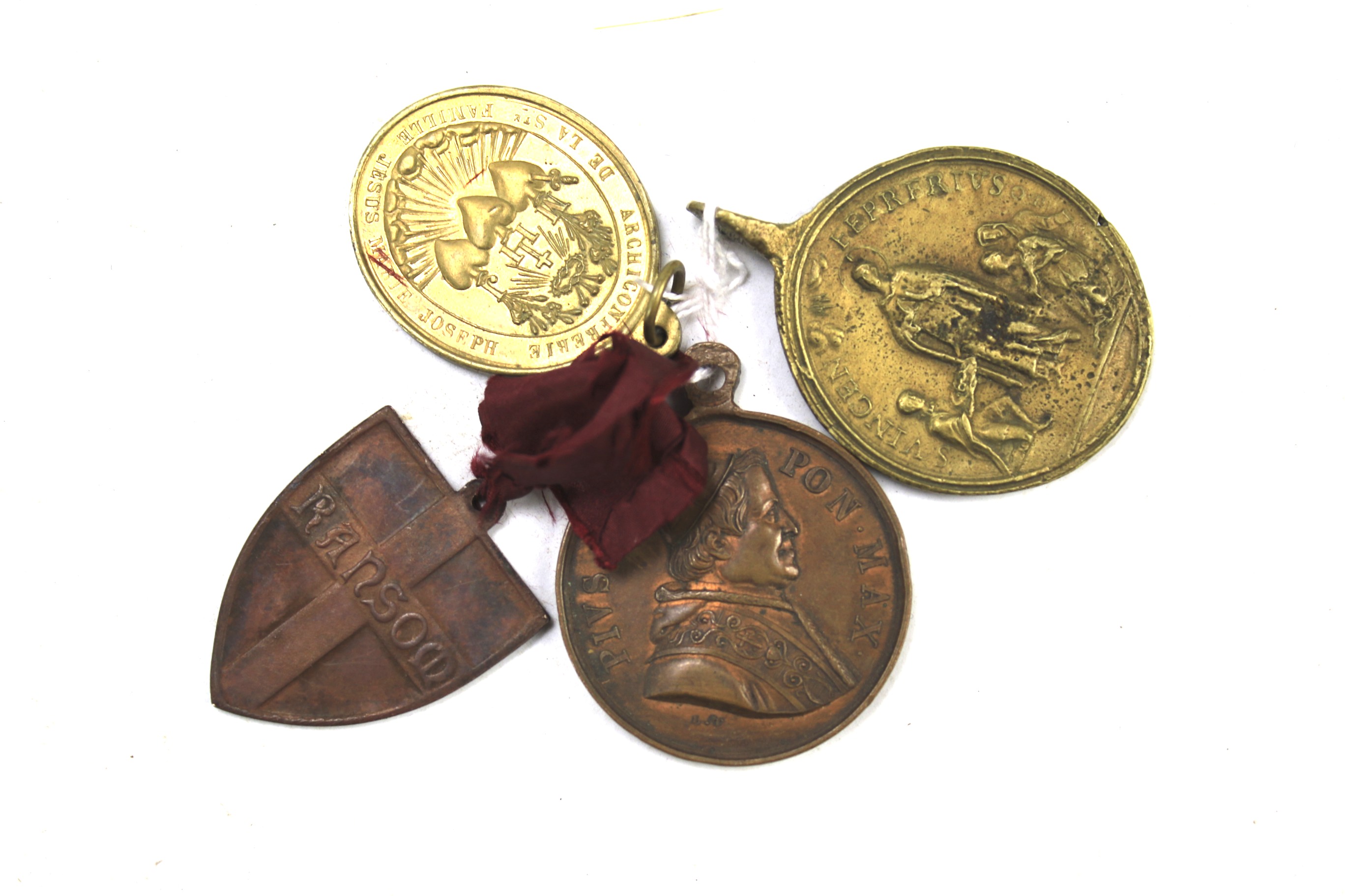Four unusual pilgrim medals.