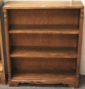 A 20th century stained wooden three tier bookshelf.