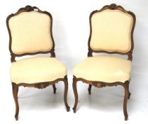 A pair of 20th century hall chairs.