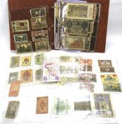 An album containing an assortment of vintage bank notes.