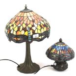 Two reproduction Tiffany style leaded glass table lamps.