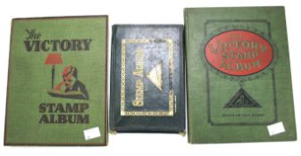 Three early 20th century stamp albums partly mounted with worldwide stamps.