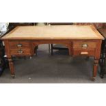 A large mid-century oak desk.