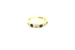 A 9ct gold half eternity ring. Set with blue and and white stones. Size K, weight approximately 3.