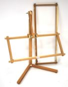 A contemporary adjustable pine weaving stand.