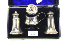 A Victorian silver cased condiment set.