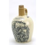 An 'Auld Long Syne' pottery bottle with wooden stopper.