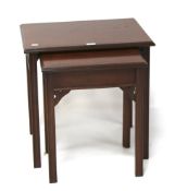 A 20th mahogany drop leaf table unit and a contemporary nest of two tables.