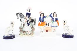 Four 19th century Staffordshire pottery figures or models.