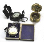 A Stanley Natural Sine marine compass, another and a Voltmeter, boxed.