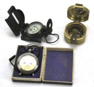 A Stanley Natural Sine marine compass, another and a Voltmeter, boxed.