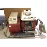 A Honda petrol generator, model E800, with the original instruction manual.