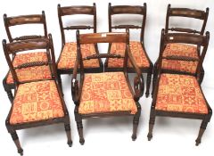 Seven mid-19th century mahogany dining chairs.