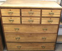 A large early-mid century oak chest of drawers.