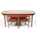 A 1960s teak extending dining table and four chairs, probably AH McIntosh.