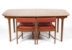 A 1960s teak extending dining table and four chairs, probably AH McIntosh.