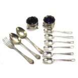 Two silver salts and glass liners and a collection of silver flatware.