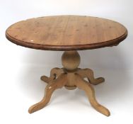 A pine tilt-top table.