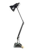 A Herbert Terry & Sons black anglepoise adjustable table lamp.