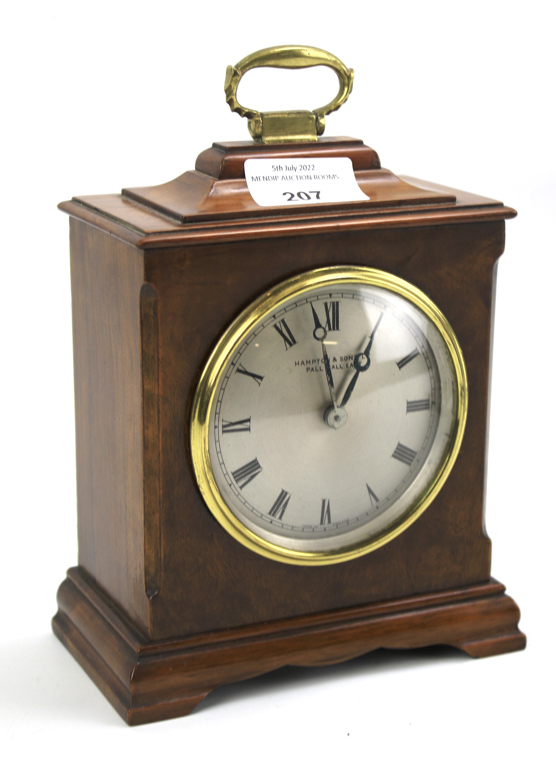 A Hampton & Sons (Pall Mall East) walnut veneered bracket clock.