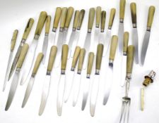A quantity of vintage French knives and a serving fork.