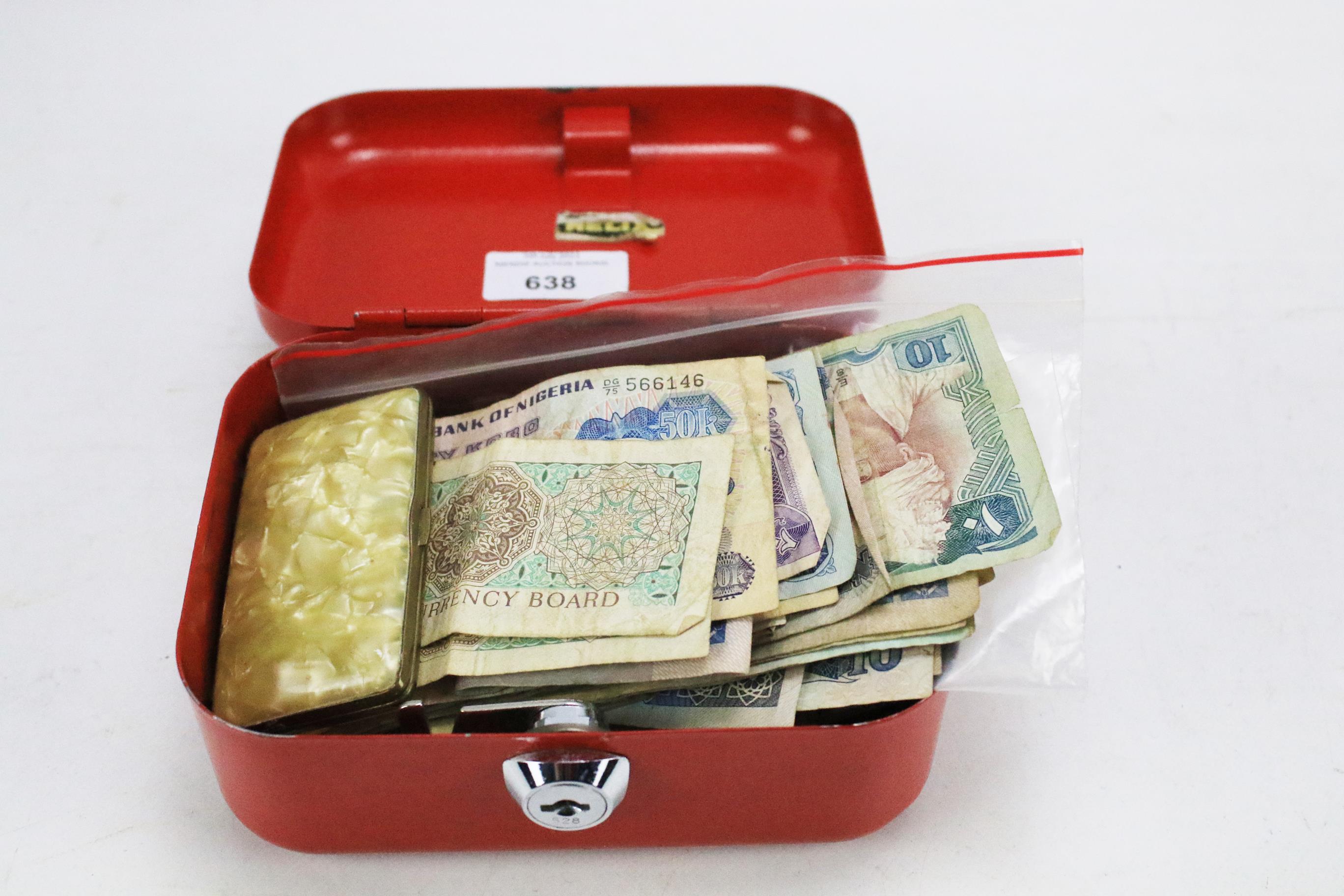 An assortment of global coins and banknotes and a pair of enamelled gilt metal mounted cufflinks.