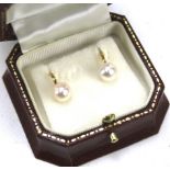 A pair of 9ct gold and pearl earrings,