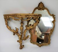 A modern giltwood rococo style mirror and a pier table.