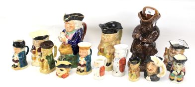 A collection of assorted ceramic Toby jugs.