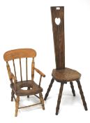 An early 20th century oak spinning chair and a child's chamber pot chair.