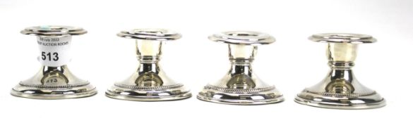 A set of four continental 800 grade silver squat candlesticks. Each measuring approximately 4.