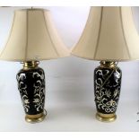 A pair of large contemporary table lamps.