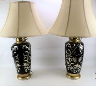 A pair of large contemporary table lamps.