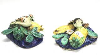 A pair of majolica wall pockets.