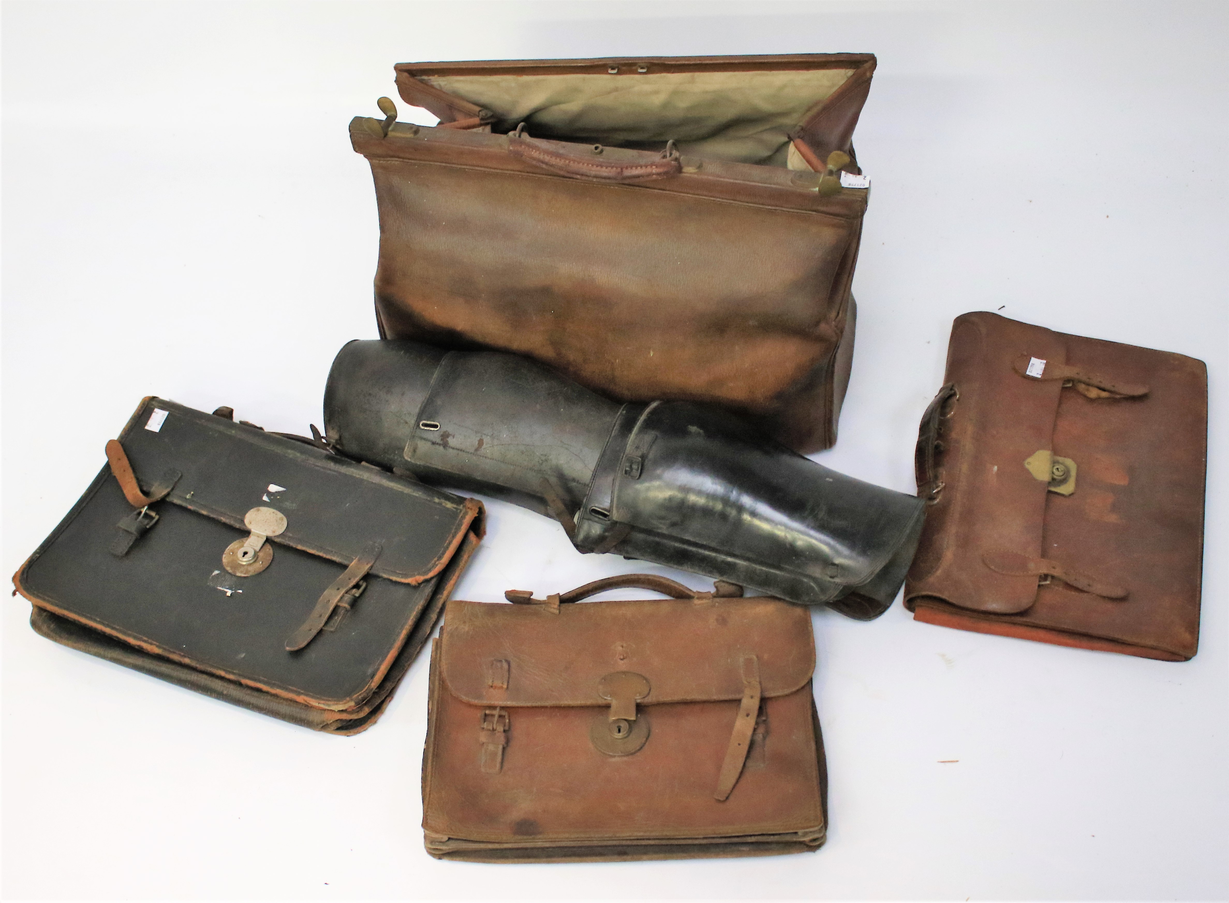 A vintage Gladstone bag and three other bags.