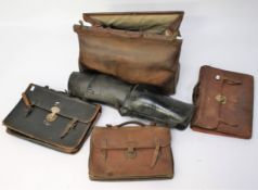 A vintage Gladstone bag and three other bags.