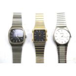 Three vintage quartz wristwatches.