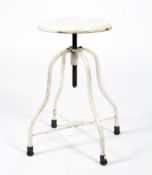 An industrial white painted metal stool.