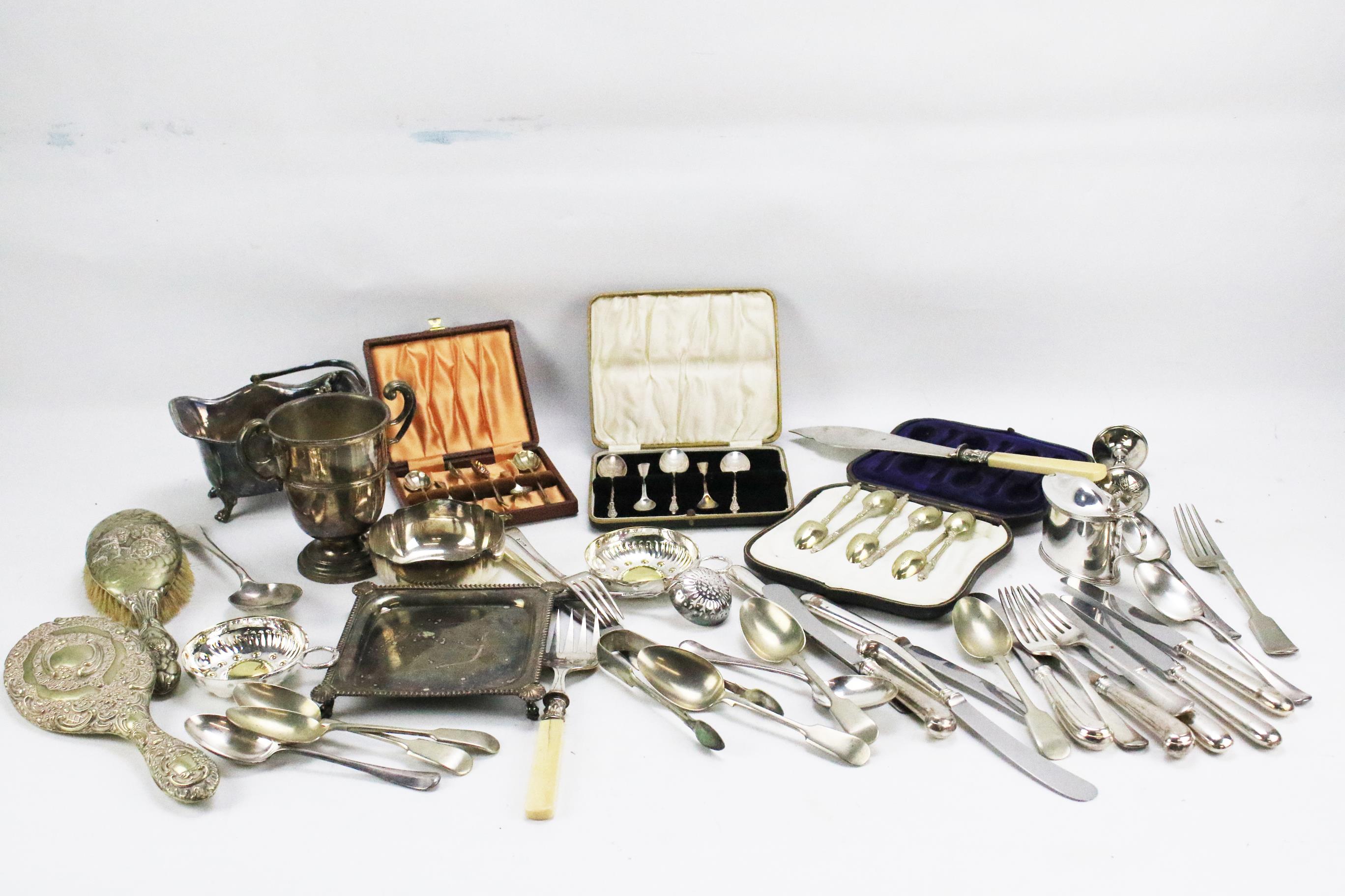 A box of silver plate including boxed spoons