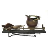An assortment of fireplace items and utensils.