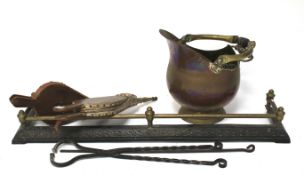 An assortment of fireplace items and utensils.